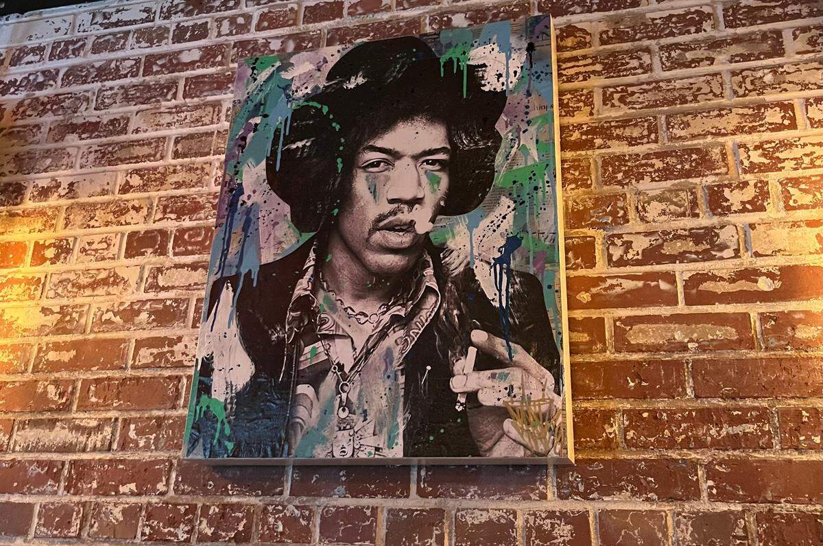 Artwork of musicians who died at age 27 — including Jimi Hendrix — hang around VINYL. The collection was done by artist Rob Dugan, who goes by Seek One.