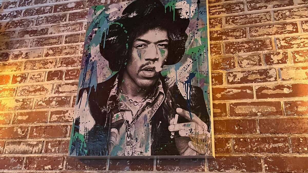 Artwork of musicians who died at age 27 — including Jimi Hendrix — hang around VINYL. The collection was done by artist Rob Dugan, who goes by Seek One.