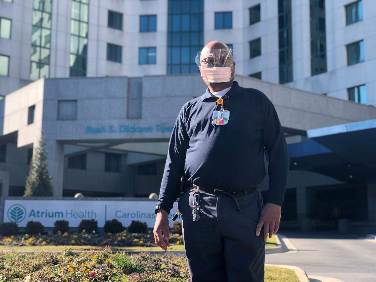As an environmental services technician at Atrium Health Carolinas Medical Center, Darryl Ellison  helps protect hospital visitors by keeping house and disinfecting equipment during the pandemic.