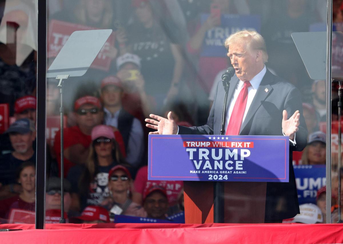 Donald Trump stands behind a barrier Saturday, Nov. 2, 2024 at a rally in Gastonia, N.C.