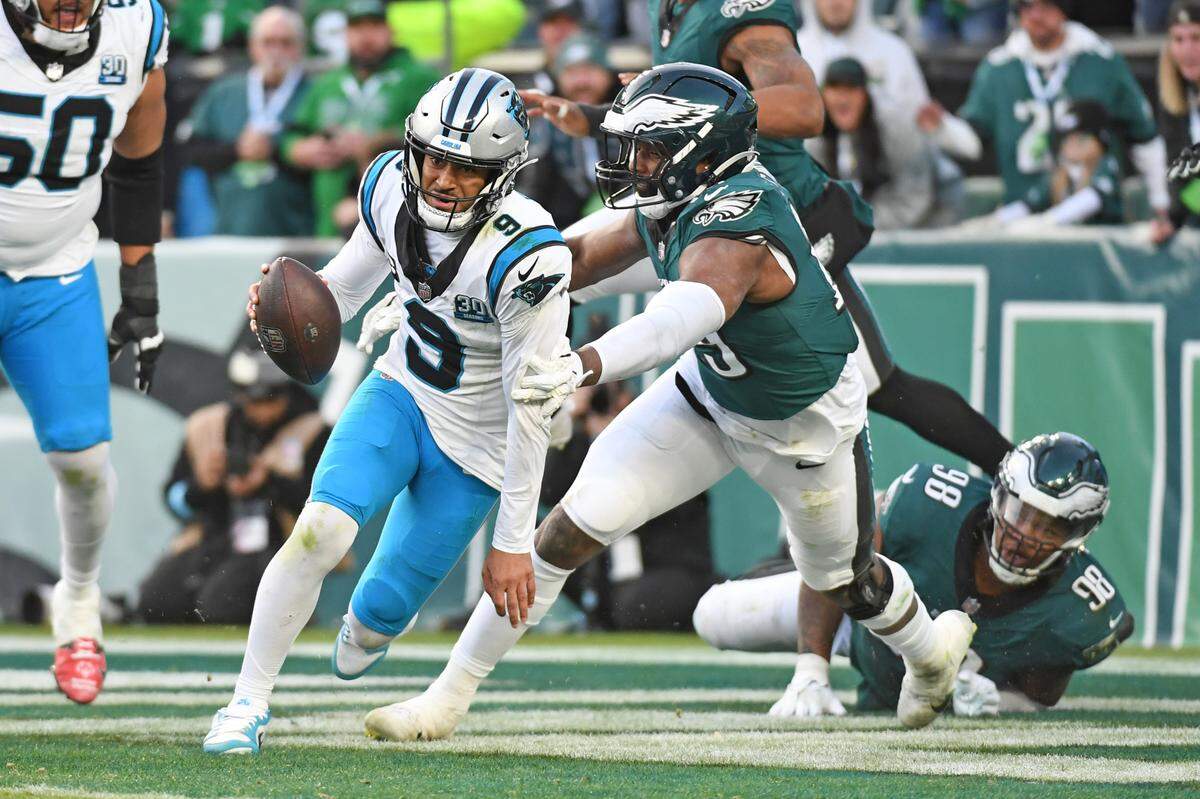 Carolina Panthers quarterback Bryce Young scrambles out of the end zone under pressure from Philadelphia Eagles linebacker Josh Sweat during Sunday’s fourth quarter at Lincoln Financial Field. Young nearly led a 97-yard touchdown drive on Carolina’s last possession, but a drop of a potential 32-yard touchdown pass to Xavier Legette sealed the Panthers’ 22-16 loss.