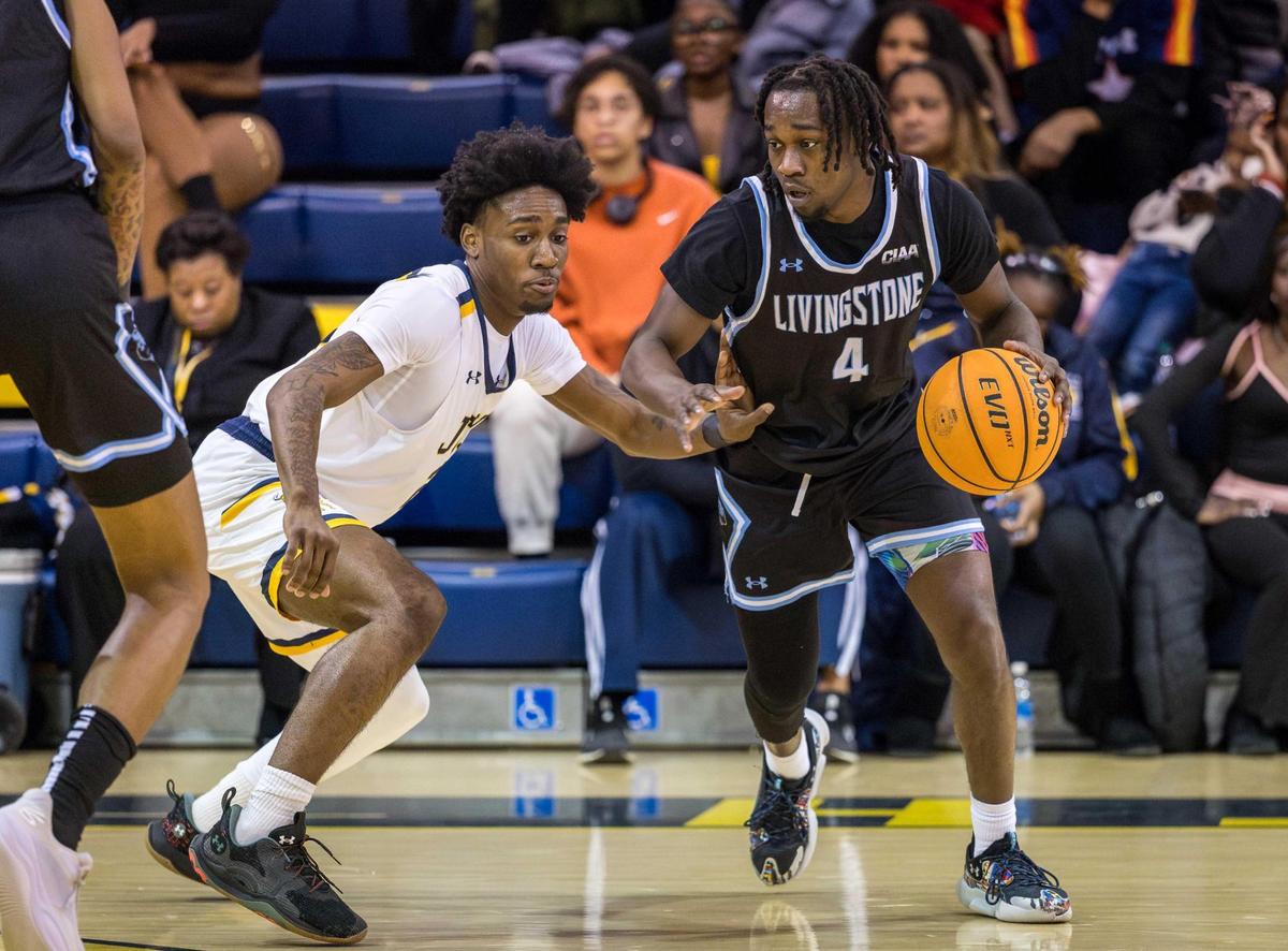 Johnson C. Smith freshman Orlando Hudson defends against Livingstone junior Donovan Leak (4) during Tuesday’s game in Charlotte. The host Golden Bulls lost the game but have a firm grip on the all-time series.