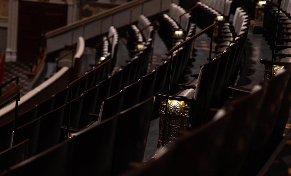 The rows of seating are flanked by an ornate gold design that also serves to light the walkway in the newly renovated and restored Carolina Theatre.