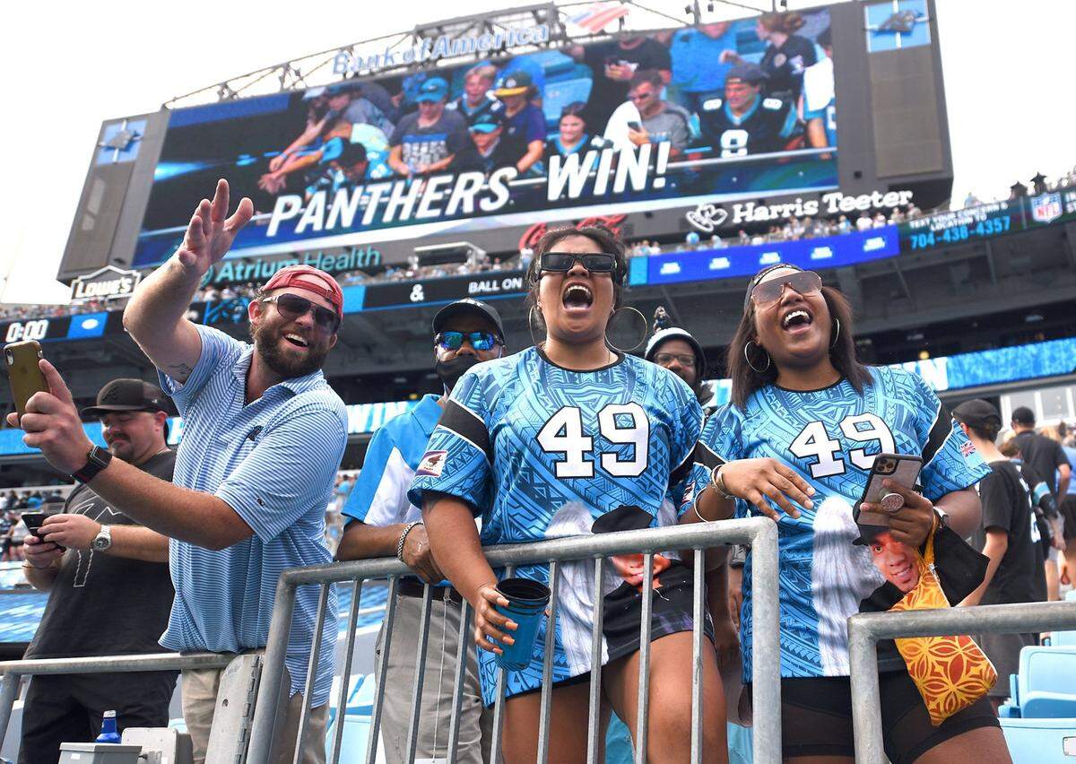 Carolina Panthers fans celebrate the team’s victory over the New Orleans Saints at Bank of America Stadium on Sunday, September 18, 2021. The Panthers defeated the Saints 26-7.