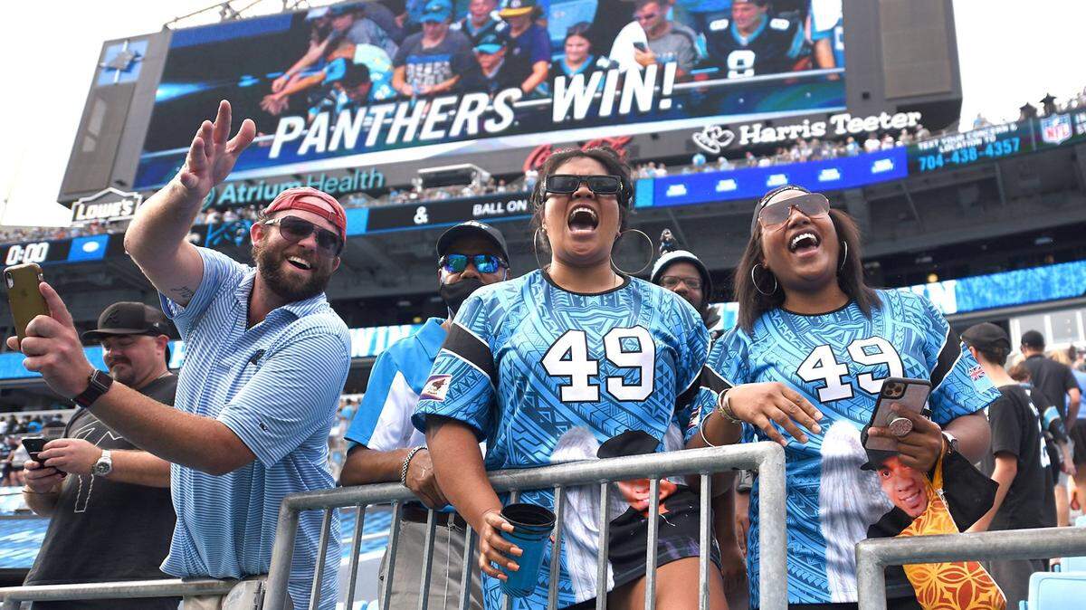 Carolina Panthers fans celebrate the team’s victory over the New Orleans Saints 2021.