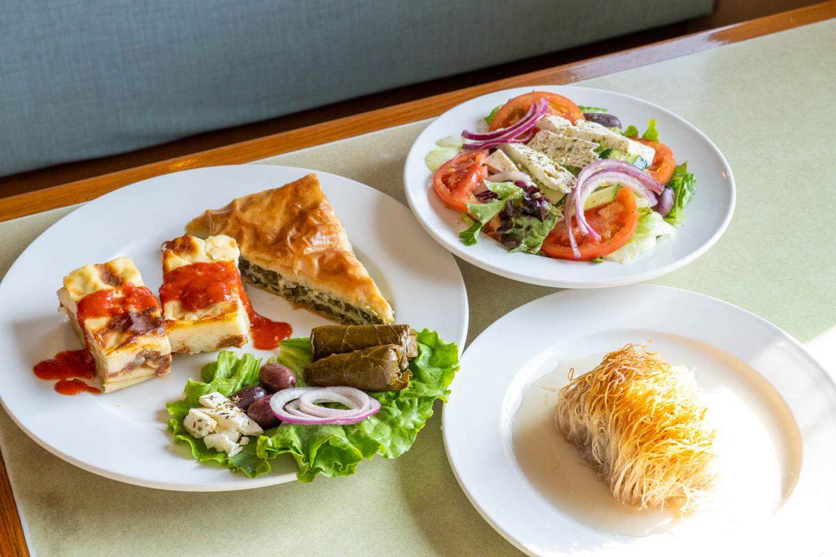 Landmark Diner’s Greek Combo includes spanakopita, grape leaves, feta, olives, Greek pastitsio and a Greek salad. The dessert is kataïfi.