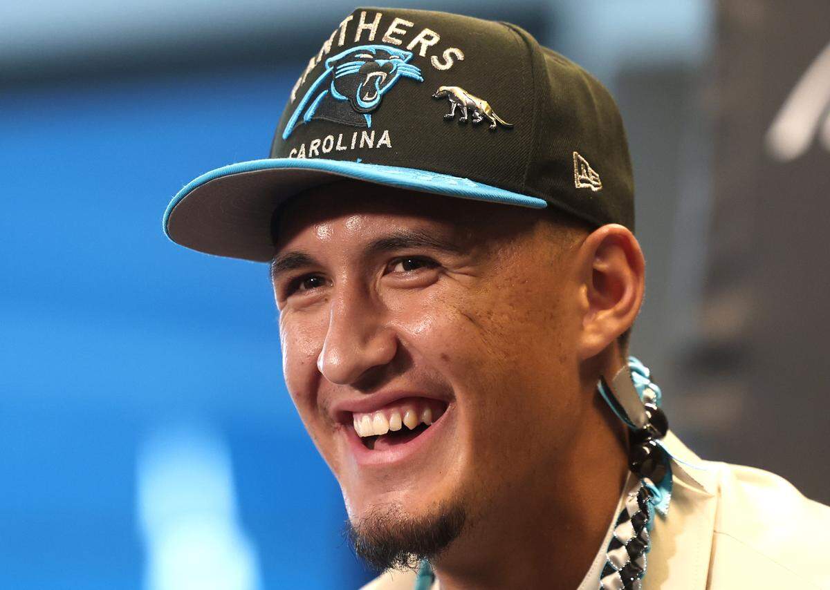 Carolina Panthers draft pick Tetairoa McMillan laughs while responding to a question during a press conference at Bank of America Stadium on Friday, April 25, 2025. The Panthers selected McMillan with the eighth pick in the 2025 NFL Draft.