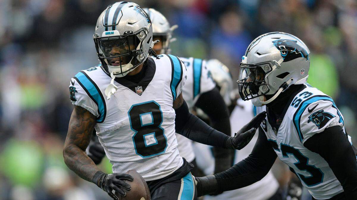 Carolina Panthers cornerback Jaycee Horn (8) celebrates his touchdown against the Seattle Seahawks during the first half of an NFL football game, Sunday, Dec. 11, 2022, in Seattle. (AP Photo/Caean Couto)