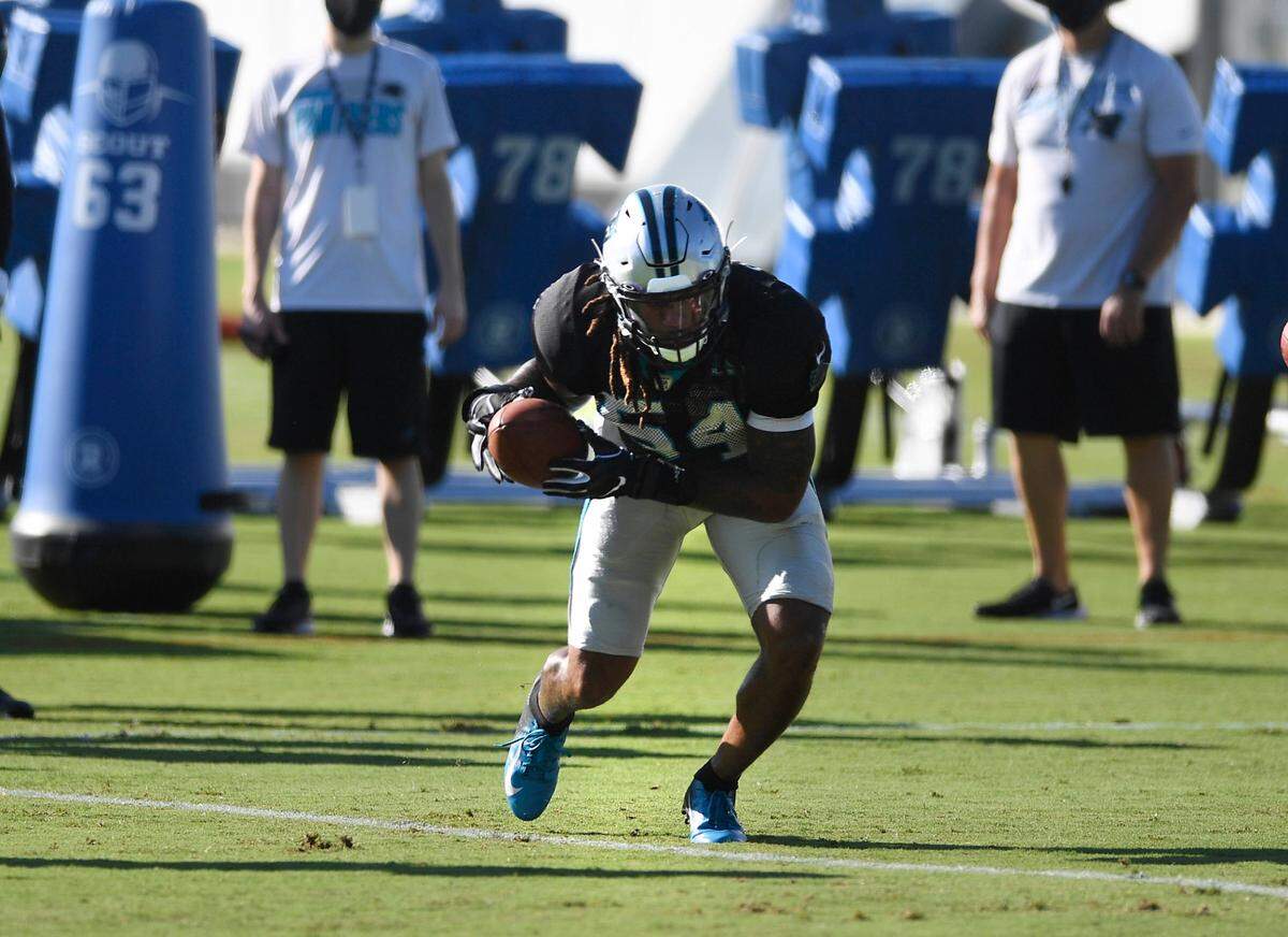 Carolina Panthers linebacker Shaq Thompson (54) picks up the ball during a drill at Carolina Panthers training camp on Tuesday, August 18, 2020.