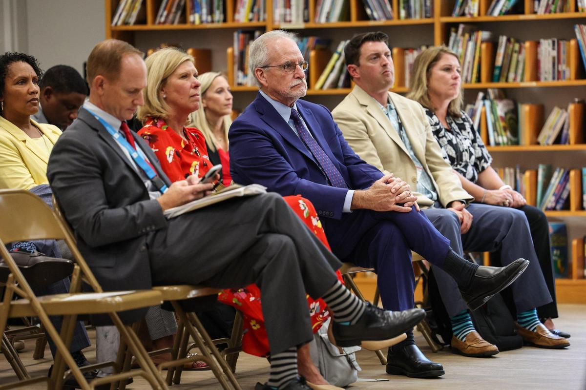 Interim Superintendent Hugh Hattabaugh, center, listens to the results of the North Carolina Department of Public Instruction 2021-2022 student academic performance data report for CMS during a press conference at Allenbrook Elementary School on Thursday, August 1,20022. The annual school accountability report helps promote the academic achievement of all public-school students and assists in understanding and gauging student and school performance against state and national standards. Key indicators include student performance on required end of grade and end of course tests, school performance grades for schools and academic growth outcomes for schools.