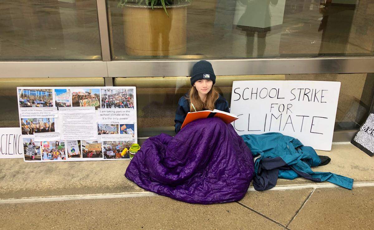 Myers Park High student Mary Ellis Stevens, 14, at one of her Friday “climate strikes” outside the Charlotte-Mecklenburg Government Center.