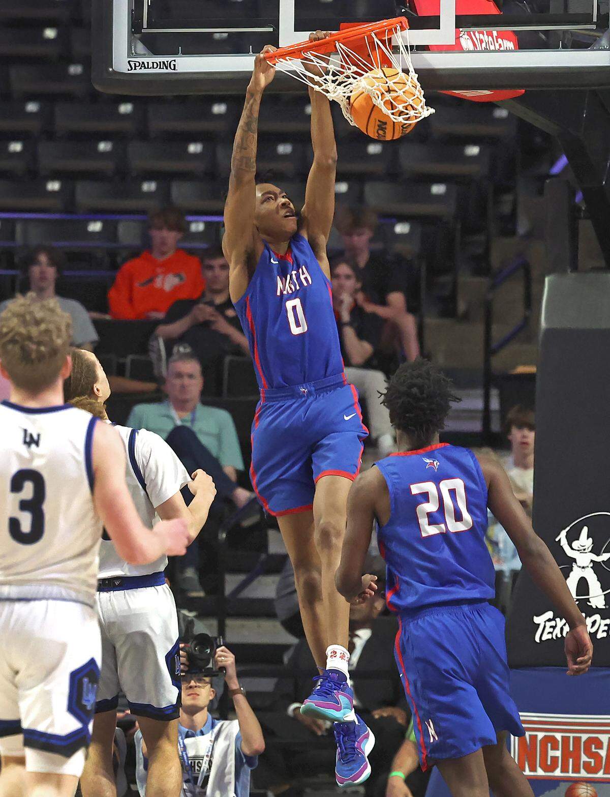 North Meck’s Isaiah Evans throws down a two-handed dunk during first-quarter action against Lake Norman in the 4A NCHSAA Regional Championship game on Thursday, March 14, 2024 at Lawrence Joel Veterans Memorial Coliseum in Winston-Salem, NC.