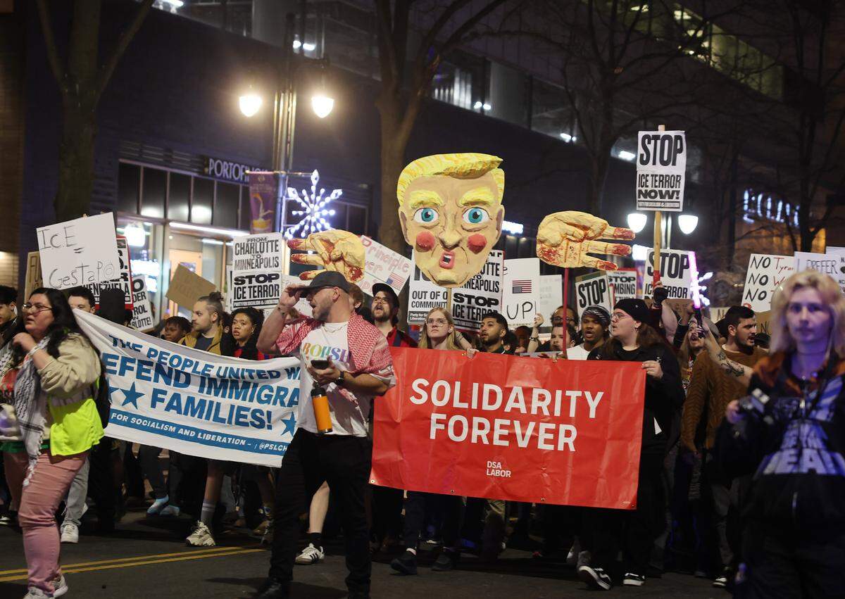 Demonstrators march in uptown Charlotte Thursday, Jan. 8, 2026 to protest ICE after a woman in Minneapolis was shot Wednesday.