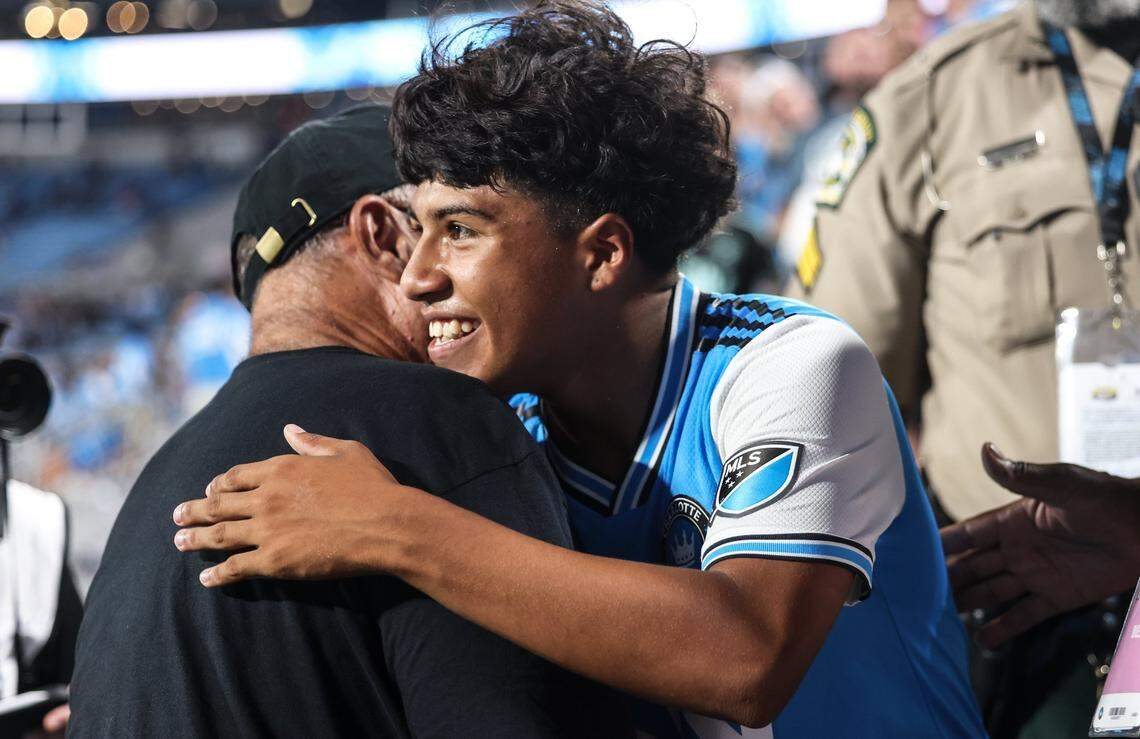 David Tepper, left, hugs Charlotte FC Brian Romero after the win against Chelsea at the Bank of America Stadium in Charlotte, N.C., on Wednesday, July 20, 2022.