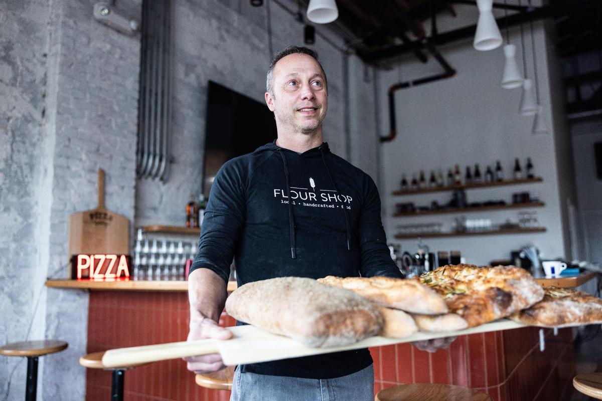 Trey Wilson, photographed at Pizza Baby in Charlotte, plans to open a second area location of the pizza joint soon. He sold his majority stake in Customshop in 2022.