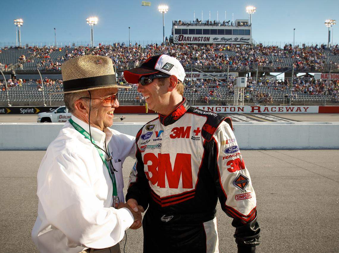In this 2012 file photo. NASCAR driver Greg Biffle, right, is congratulated by his car owner Jack Roush after he won the pole for the Bojangles’ Southern 500 at Darlington Raceway. Biffle, his wife, two kids, and one other person were killed in a plane crash Thursday at Statesville Regional Airport.
