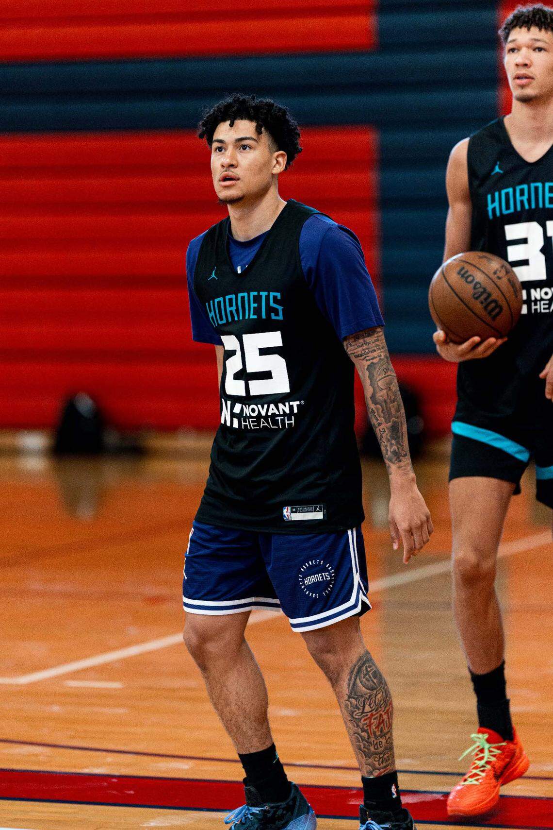 Tidjane Salaün (right) stands next to Charlotte Hornets teammate KJ Simpson at summer league practice in Las Vegas.