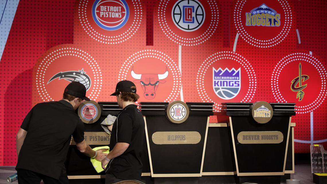 Stage hands prepare the set for the NBA basketball draft lottery Tuesday in Chicago.