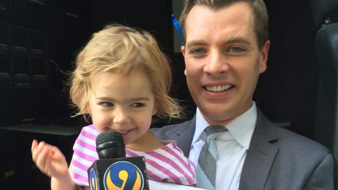 John Paul holds a microphone for one of his daughters not long after he joined WSOC-TV Channel 9 in Charlotte, NC, in 2015. Paul announced on July 25, 2022, that he will be leaving the station for a job in Philadelphia.