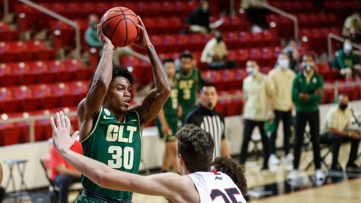 Charlotte guard Jhery Matos (30) looks to pass over Davidson forward Luka Brajkovic (35) last month. The 49ers have fallen into a habit of winning one game and losing the next.