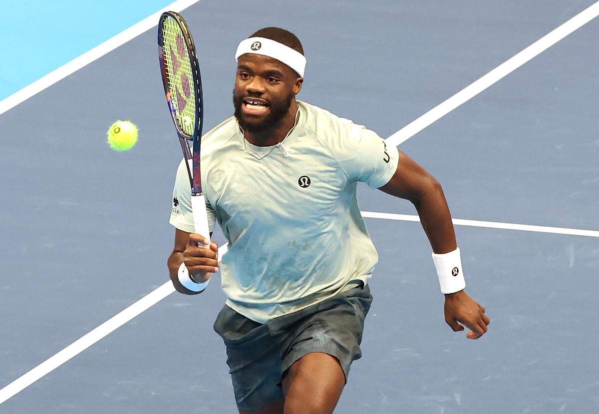 Frances Tiafoe chases a ball deep to the baseline during his match against Taylor Fritz in the Charlotte Invitational Thursday.
