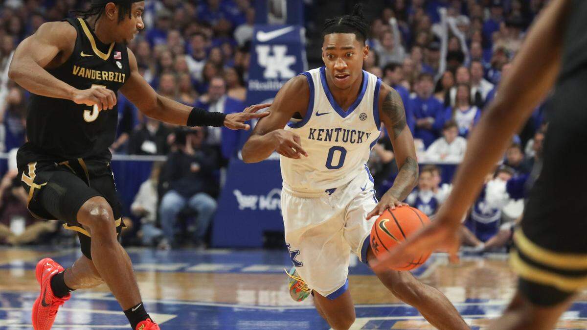Kentucky’s guard Rob Dillingham (0) drives past Vanderbilt’s guard Ezra Manjon (5) during the first half of an NCAA basketball game at Rupp Arena in Lexington, Ky., Wednesday, Mar. 6, 2024