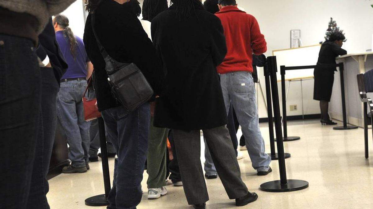 People line up at the N.C. Employment Security Commission office. More than 1 million people have applied for unemployment since the governor issued a stay-at-home order in mid-March.