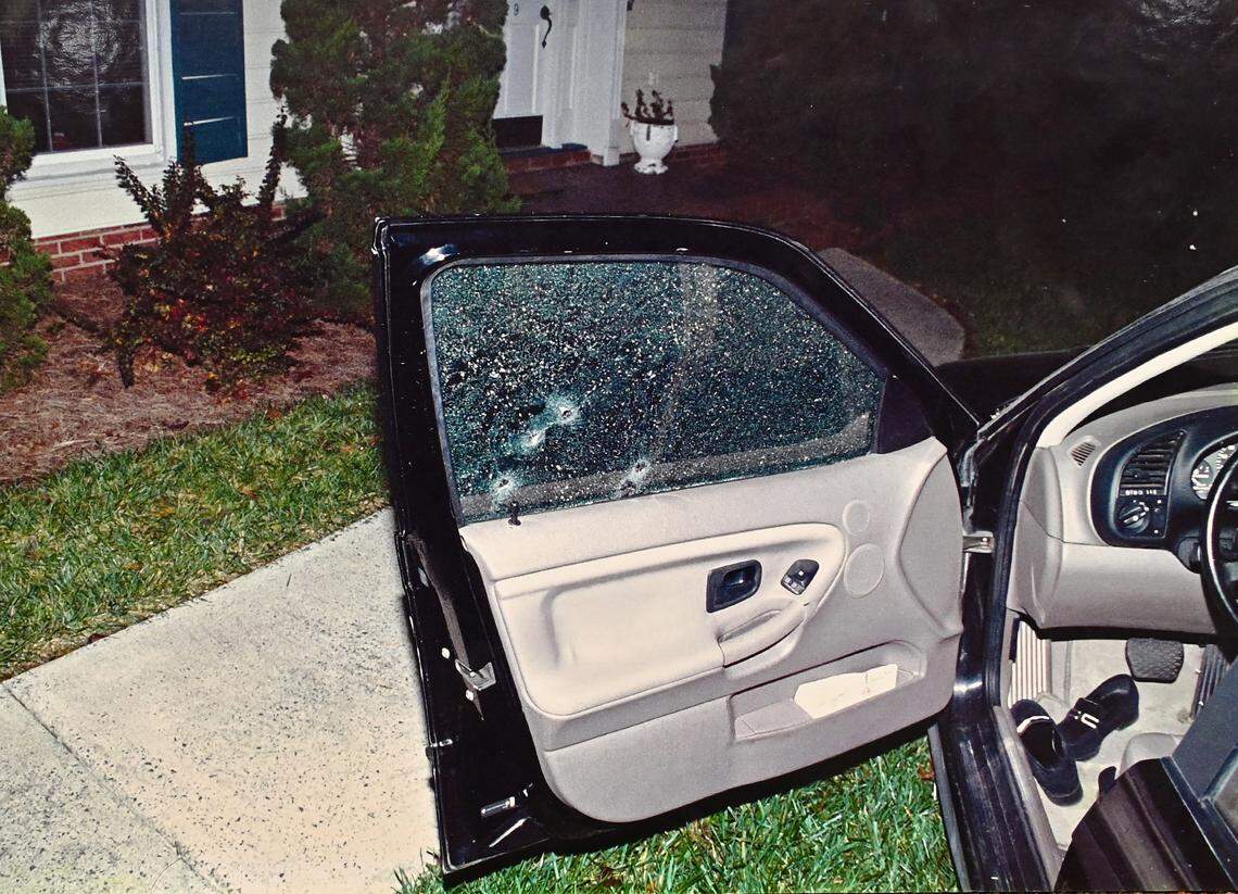 An evidence photo shows four bullet holes in the car window of the black BMW driven by Cherica Adams on the night of November 16, 1999. Pregnant at the time with the baby of then-Carolina Panthers wide receiver Rae Carruth, Adams saved her baby’s life by calling 911.