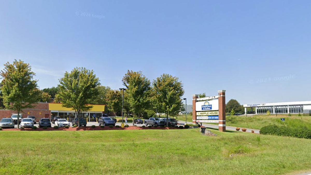 A woman was hospitalized after being shot during an altercation in the parking lot of this Hickory Waffle House on Sunday, police said.