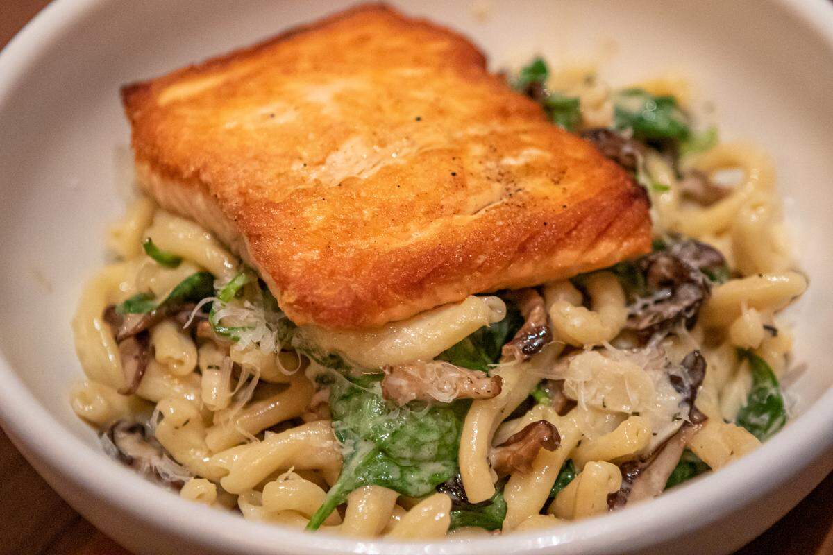 Strozzapreti at North Italia: Salmon, roasted mushroom, spinach, toasted pine nut, parmesan cream.