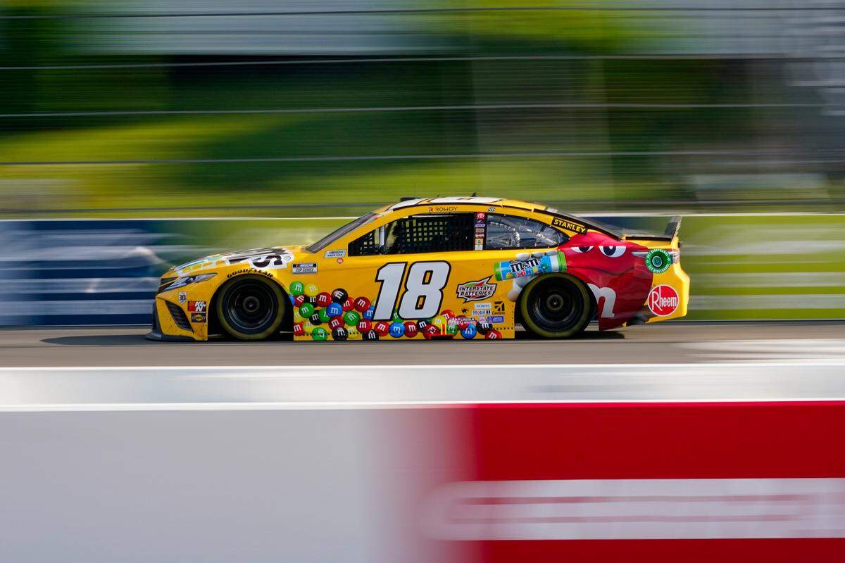 Kyle Busch (18) motors around the track during a NASCAR Cup Series auto race at Pocono Raceway, Sunday, June 27, 2021, in Long Pond, Pa. (AP Photo/Matt Slocum)