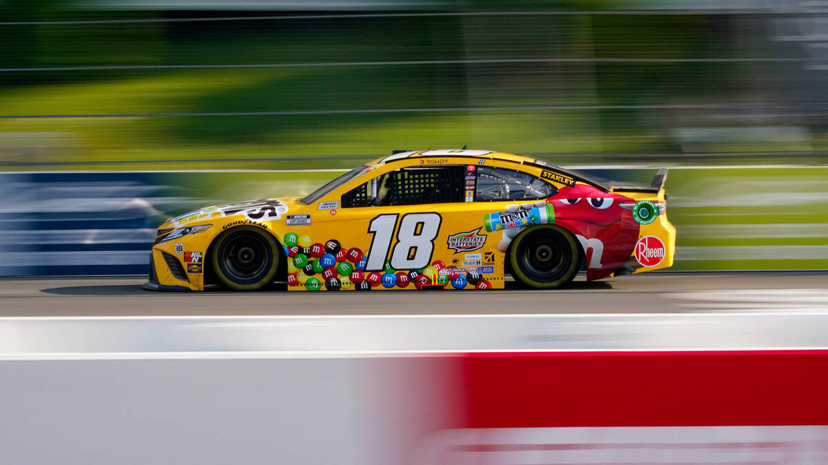 Kyle Busch (18) motors around the track during a NASCAR Cup Series auto race at Pocono Raceway, Sunday, June 27, 2021, in Long Pond, Pa. (AP Photo/Matt Slocum)