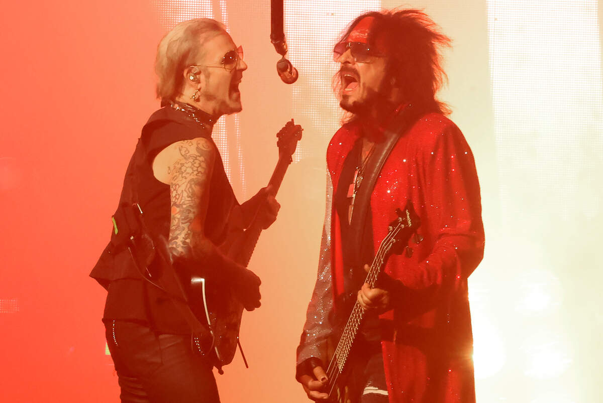 Mötley Crüe lead guitarist John 5, left, and bassist Nikki Sixx perform during “The Return of the Carnival of Sins” tour at Truliant Amphitheater in Charlotte on Monday night.