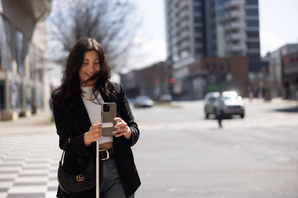 Charlotte influencer Sydney Bernhardt films content for her TikTok in uptown Charlotte in early March.