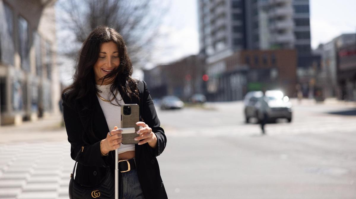 Charlotte influencer Sydney Bernhardt films content for her TikTok in uptown Charlotte in early March.