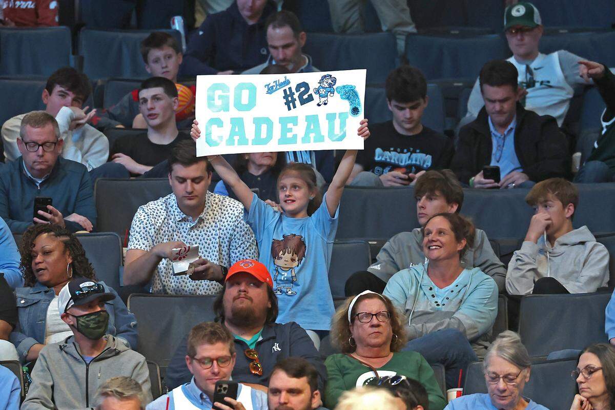 UNC Tar Heels fan Sophia Morrison of Concord, NC shows her support for Tar Heels freshman Elliot Cadeau prior to the start of the team’s game against Wagner at Spectrum Center in Charlotte, NC on Thursday, March 21, 2024. The Tar Heels battled Wagner in the First Round of the 2024 NCAA Division 1 Men’s Basketball Championship at Spectrum Center in Charlotte, NC on Thursday, March 21, 2024.