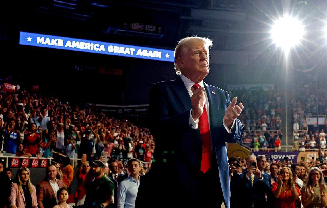 Former President Donald Trump claps with supporters during a campaign rally at Bojangles Coliseum in Charlotte, NC on Wednesday, July 24, 2024.
