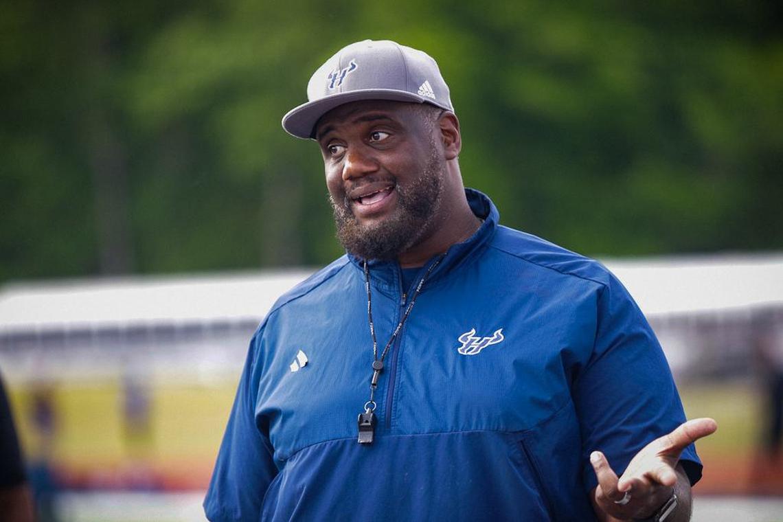 Hickory Ridge Jupiter Wilson shares words of wisdom to his team to after they come off the field at the High School football prospect day recruiting showcase at Hickory Ridge High School
