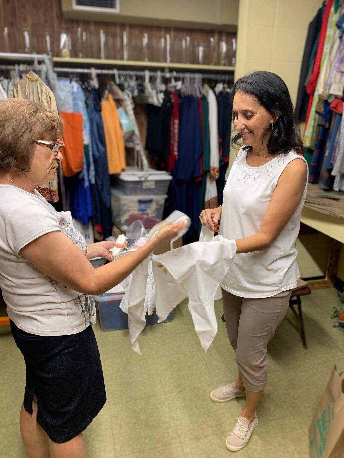 Olympia Bisbikis (left) and Elaine Mahairas make repairs in the costume room at Holy Trinity Greek Orthodox Cathedral in preparation for the 2020 Hellenic Dance Festival.