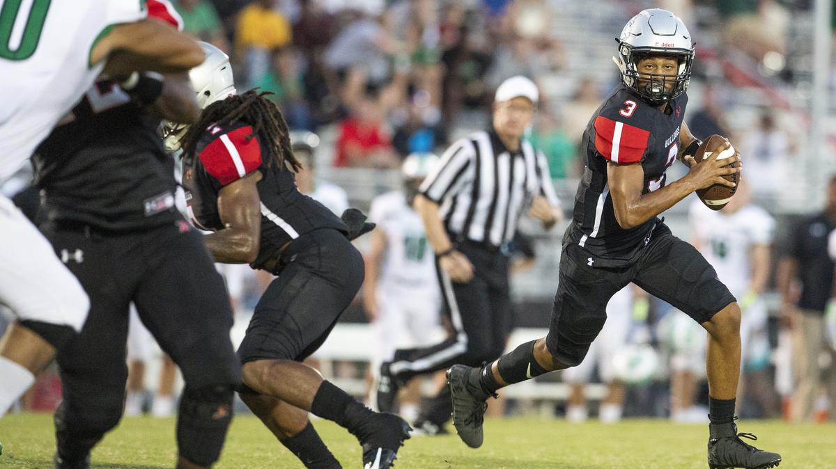 Butler quarterback Christian Peters looks for throwing room against Myers Park during a high school football game at Butler High last Friday.