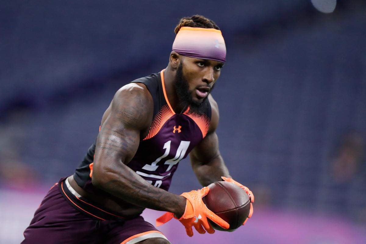 Clemson defensive back Mark Fields runs a drill at the NFL football scouting combine in Indianapolis, Monday, March 4, 2019. (AP Photo/Michael Conroy)