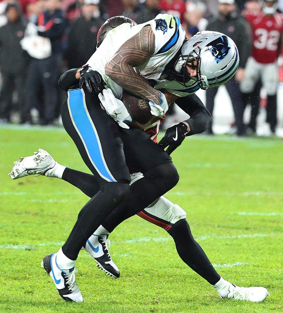 Carolina Panthers wide receiver Tetairoa McMillan catches a deep pass from quarterback Bryce Young during action against the Tampa Bay Buccaneers at Raymond James Stadium in Tampa, FL. on Saturday, January 3, 2026. The Buccaneers defeated the Panthers 16-14.