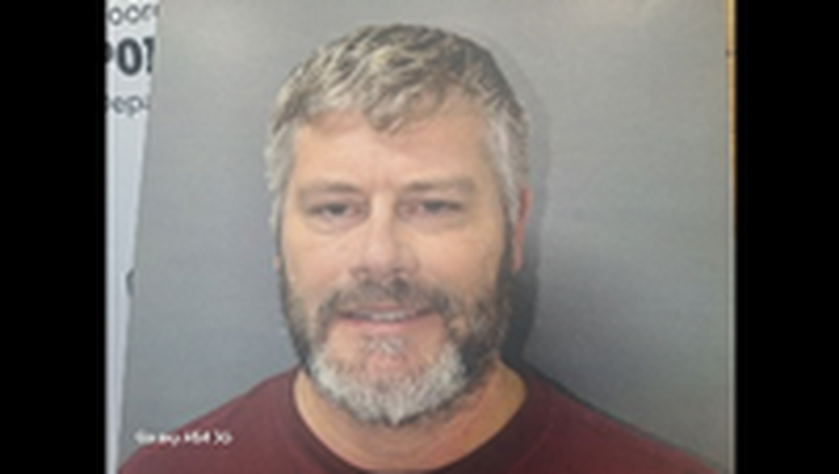 Former Davidson College appeared in court in Mooresville on a felony secret peeping charge,