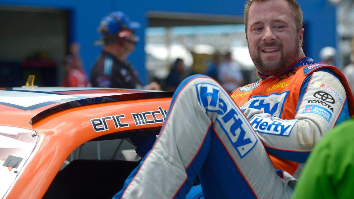 FILE - In this July 5, 2013 file photo, Eric McClure gets out of his car after finishing his laps during qualifying for a NASCAR Nationwide auto race at Daytona International Speedway in Daytona Beach, Fla. Former NASCAR driver McClure died Sunday, May 2, 2021, his family and the series said. He was 42. (AP Photo/Phelan M. Ebenhack, File)