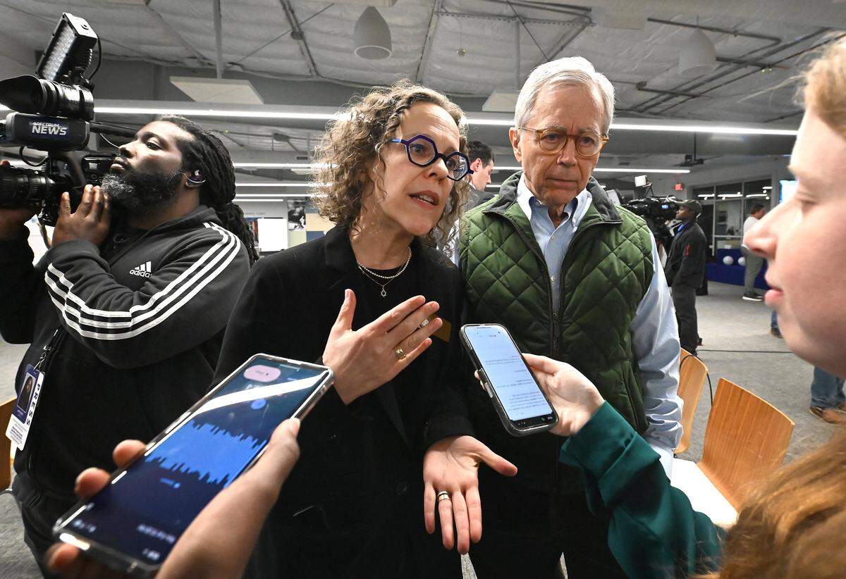 Mecklenburg County commissioner Leigh Altman, left, discusses the transit and transportation sales tax following the referendum passing on Tuesday, November 4, 2025. At right is Charlotte City Council member Ed Driggs, right, looks on.