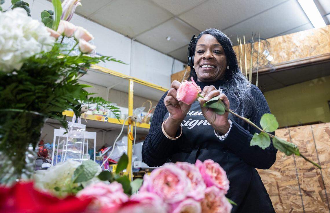 Christina Nevins works on flower arrangements for Valentine’s Day at Stroud Florist in Charlotte, N.C., on Thursday, February 9, 2023. 