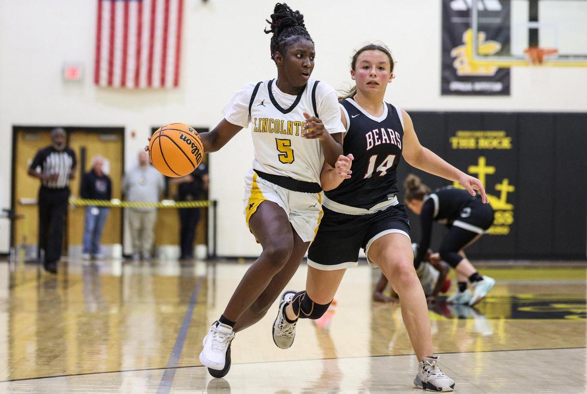 Lincolnton’s Nyla Johnson, left, drives the ball past Bunker Hill’s Serena Thurman during the game in Lincolnton, NC on Friday, January 24, 2025.