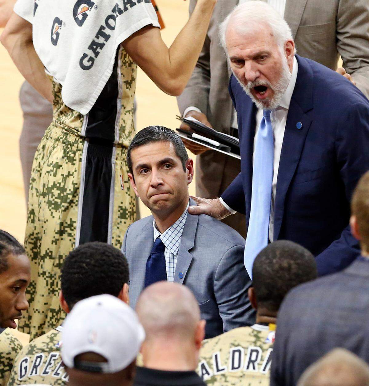 James Borrego (center), worked for Gregg Popovich (right) first in the San Antonio Spurs’ video department and then in two stints as an assistant coach before the Charlotte Hornets hired him as head coach last spring.