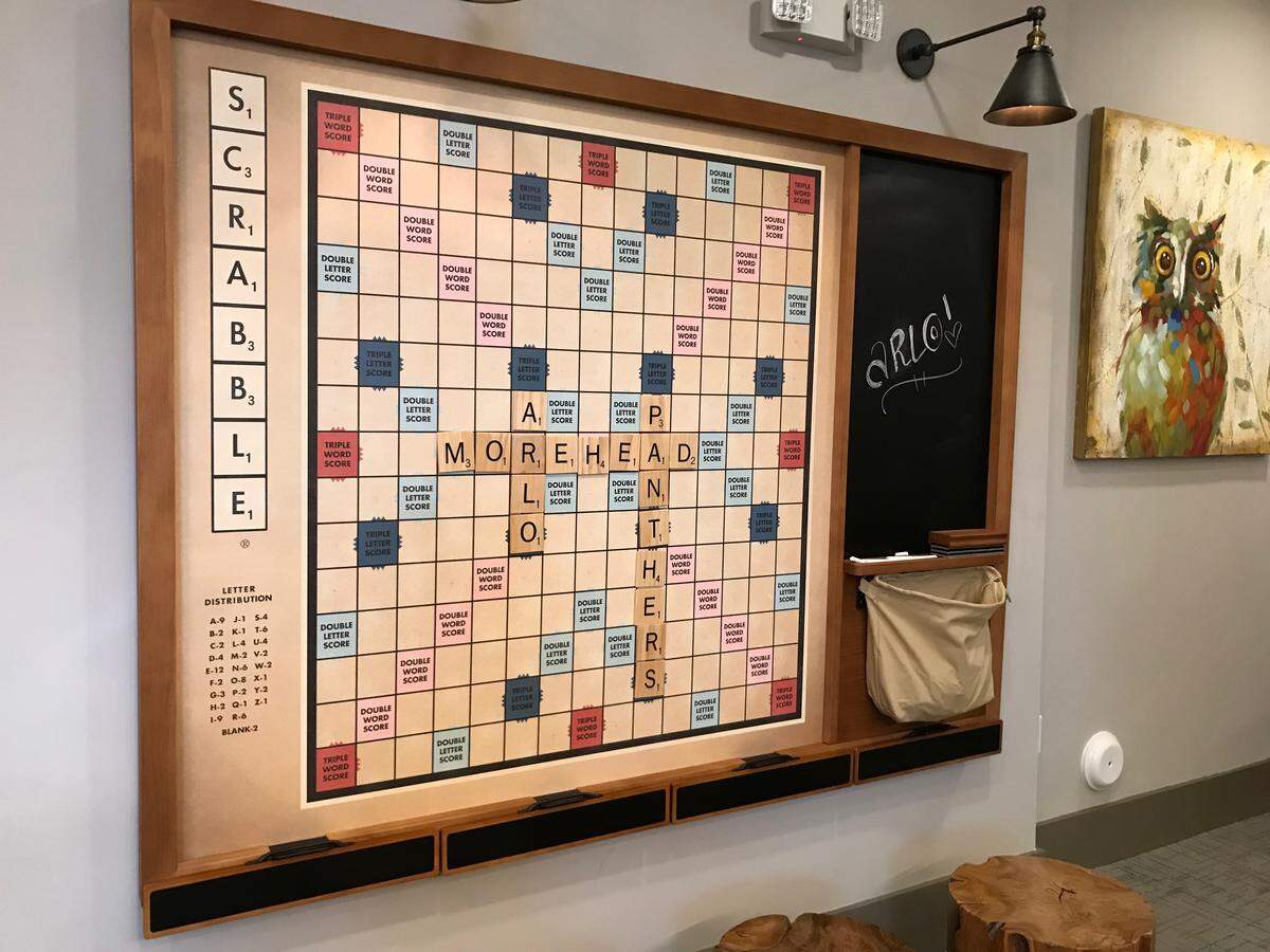 A wall-mounted magnetic Scrabble board among the amenities at the Arlo apartment complex.