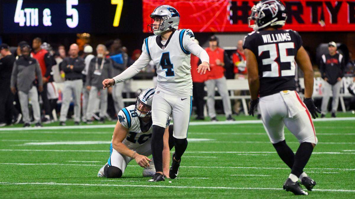 Carolina Panthers place kicker Eddy Pineiro (4) watches his 37-yard field goal during the first half of an NFL football game against the Atlanta Falcons Sunday, Oct. 30, 2022, in Atlanta. (AP Photo/John Amis)